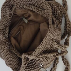 The sack crocheted tan backpack